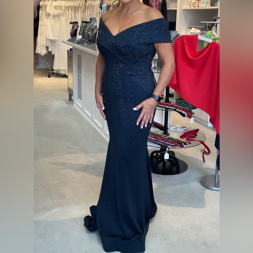 I’m 5’7 & 185 Navy stretchy gown worn once to son’s indoor black tie wedding.